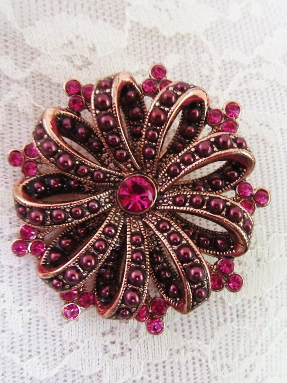 Liz Claiborne copper ribbon brooch with red & pink rhinestones